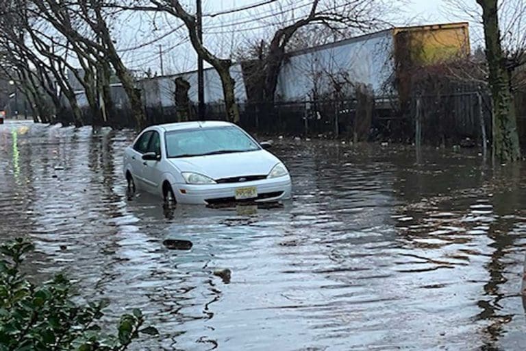 Photo of a submerged car from recent neighborhood flooding in Camden, NJ